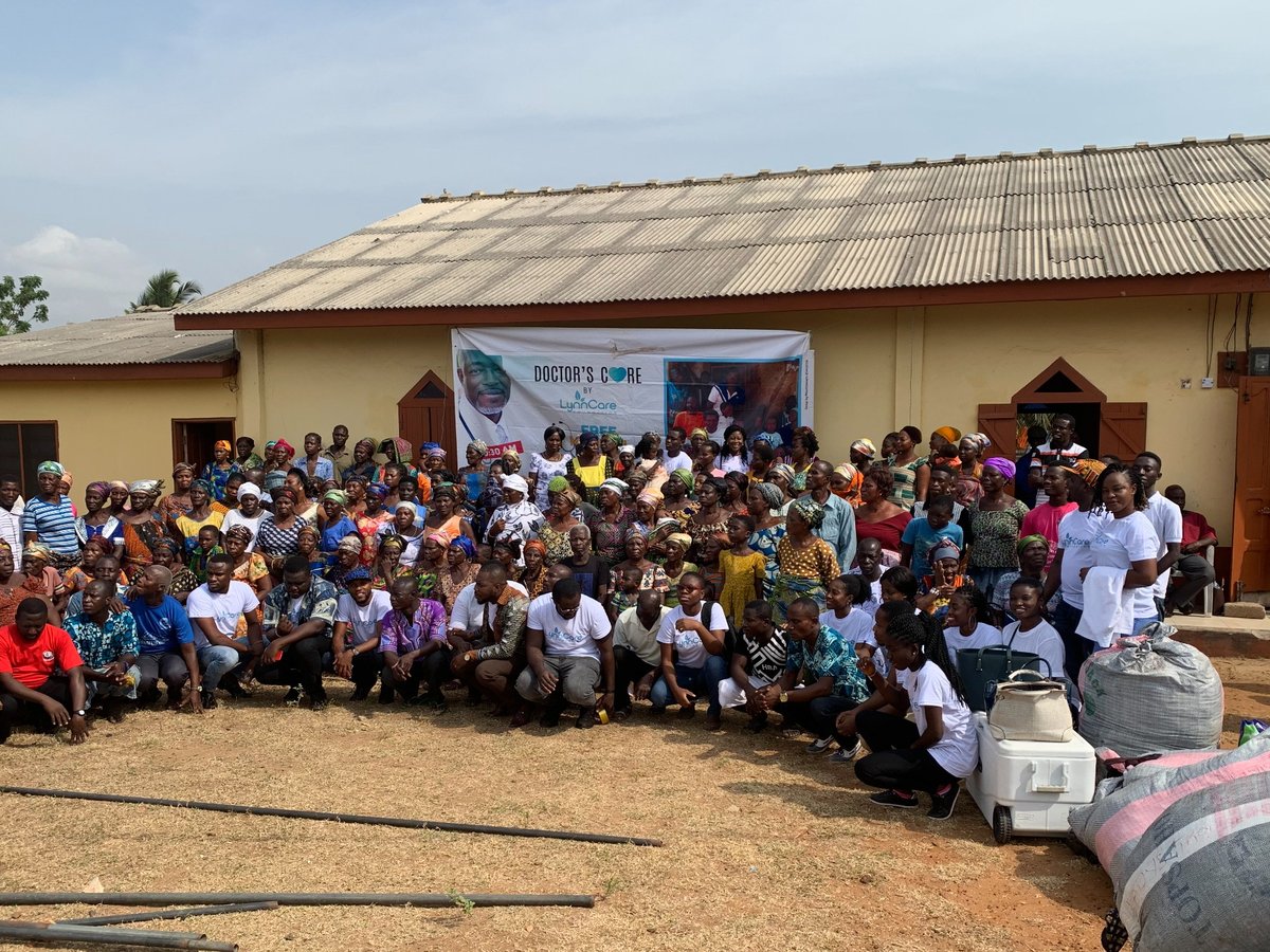 A large community gathering at an outreach day in Ghana