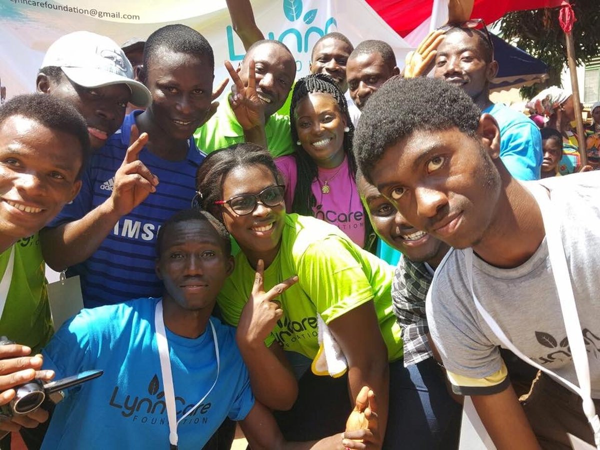 Volunteers and community members at an outreach event in Ghana